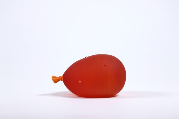 Dylan Martinez - Sunset Orange Water Balloon (droplets), 2024, Glass sculptures - hot sculpted, sandblasted, acid etched